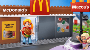 A NovaBrix figurine is standing in front of a McDonalds Macca's Makers brick set holding a burger