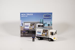 A NovaBrix Lowes Pro Supply Truck with a figurine